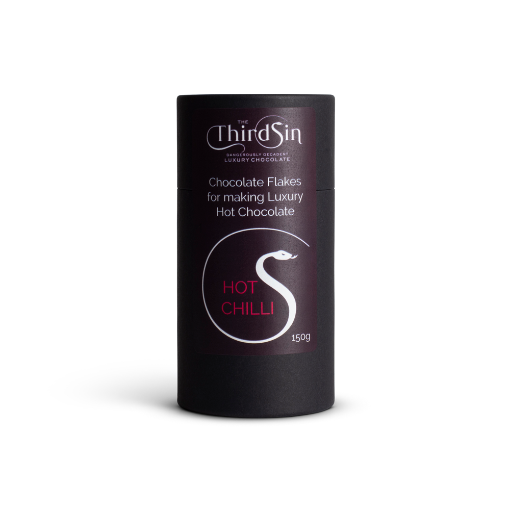 Black cylindrical container of 'The Third Sin' hot chilli chocolate flakes on a white background