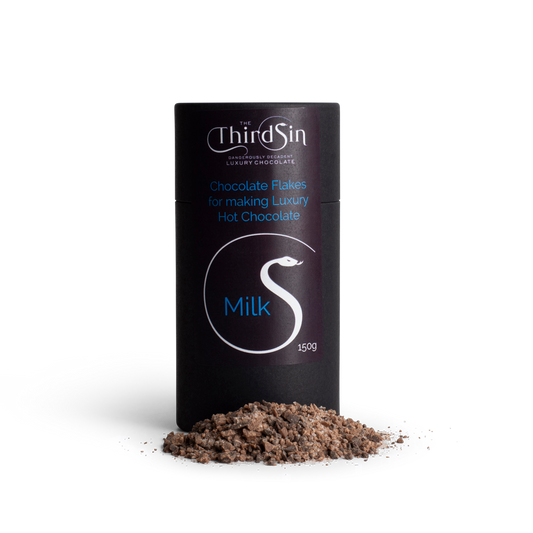 Container of 'The Third Sin' milk chocolate flakes on a white background