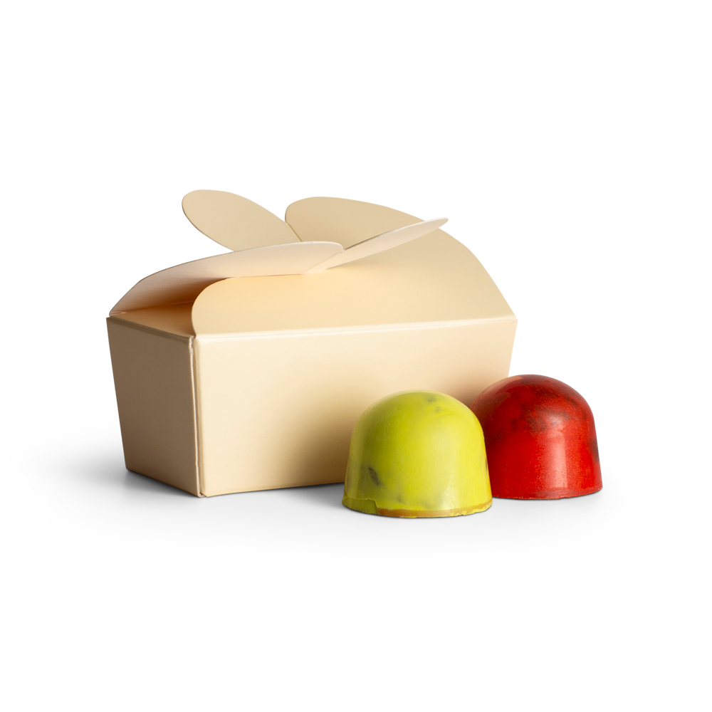 Beige gift box with two decorative choclates on a white background