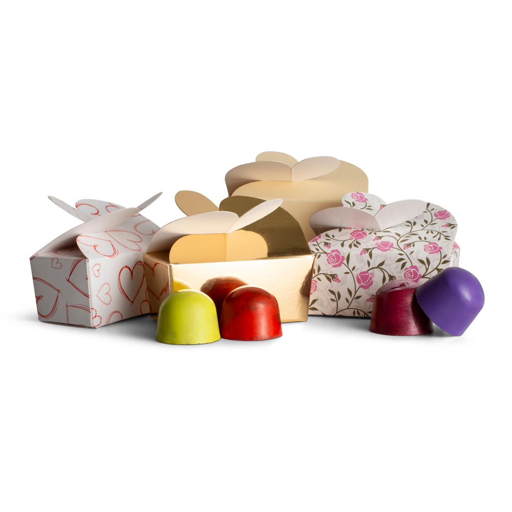 Colorful chocolate truffles in various boxes on a white background